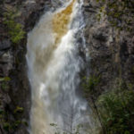 Colour photo of waterfall over a narrow cliff